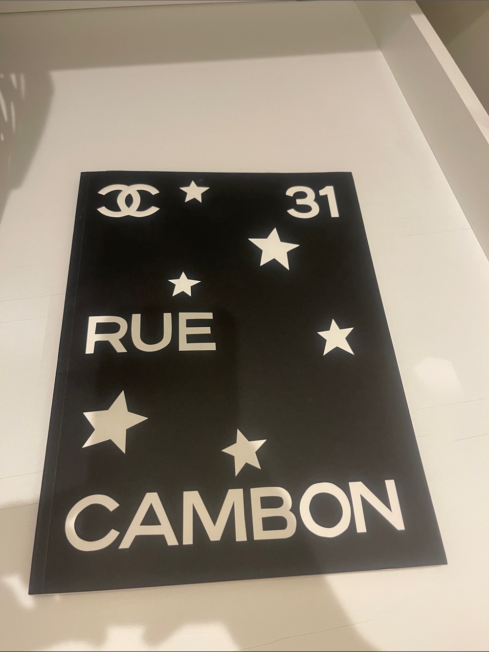 CHANEL Black and White Rue Cambon Star Plaque